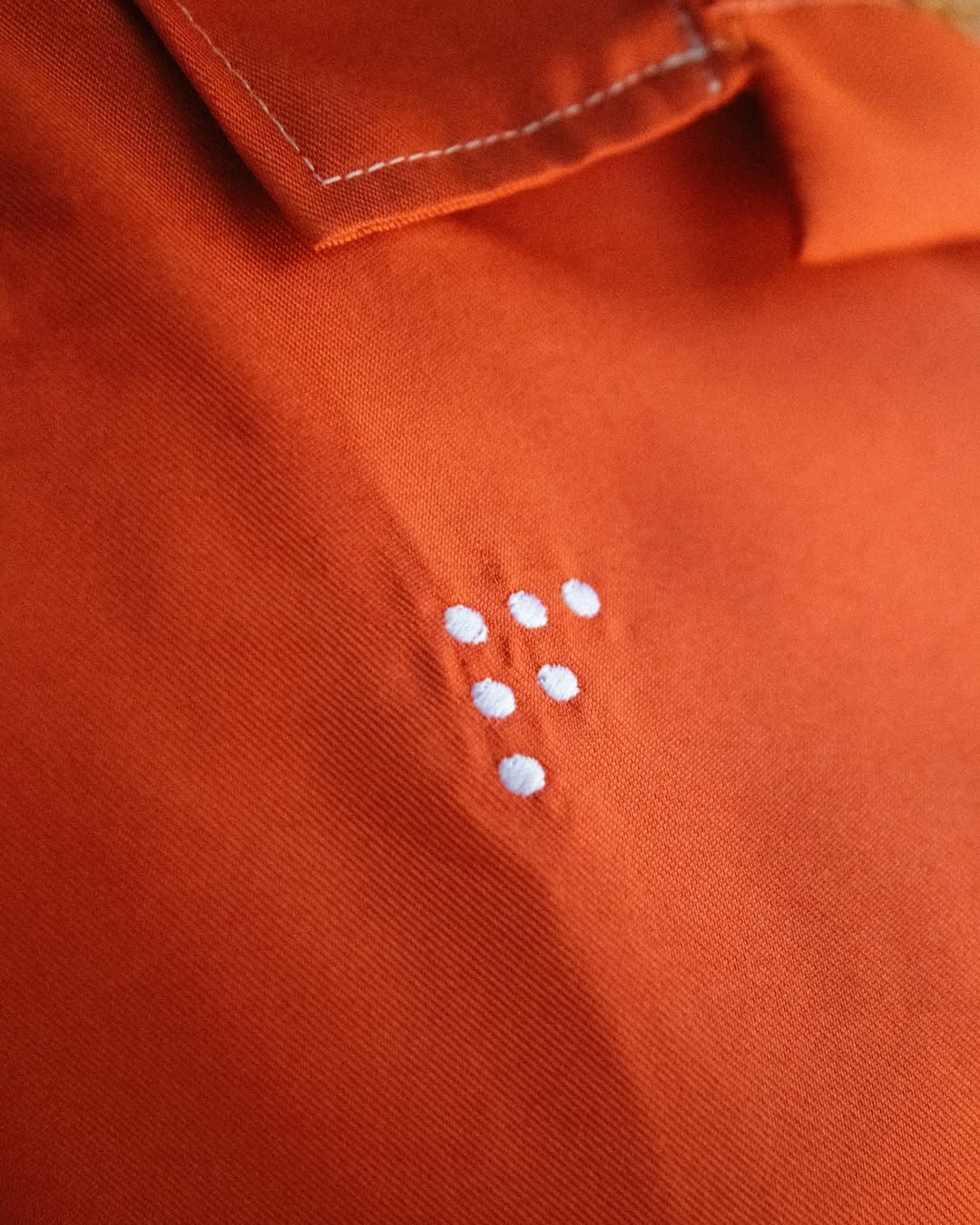 SPRING INTO ACTION ORANGE CAMP SHIRT